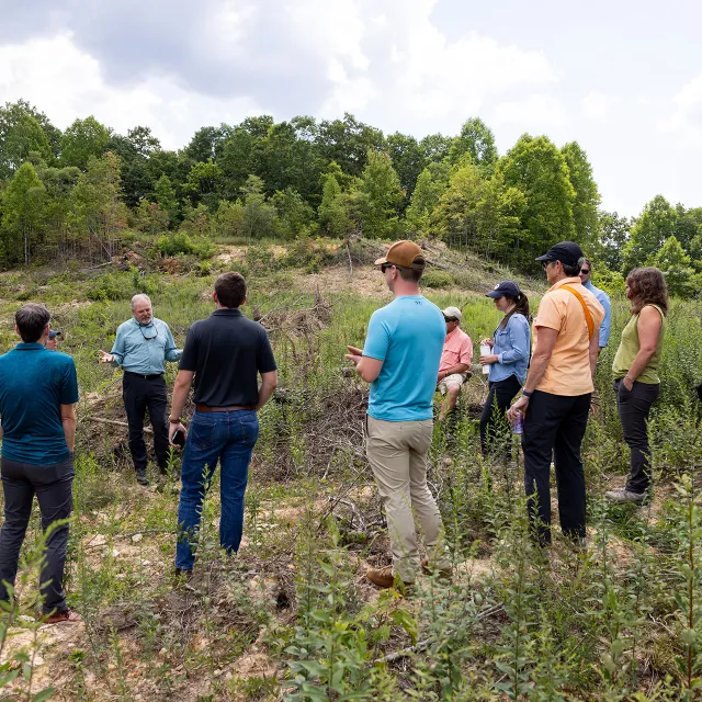 group of planting partners at a planting site visit.