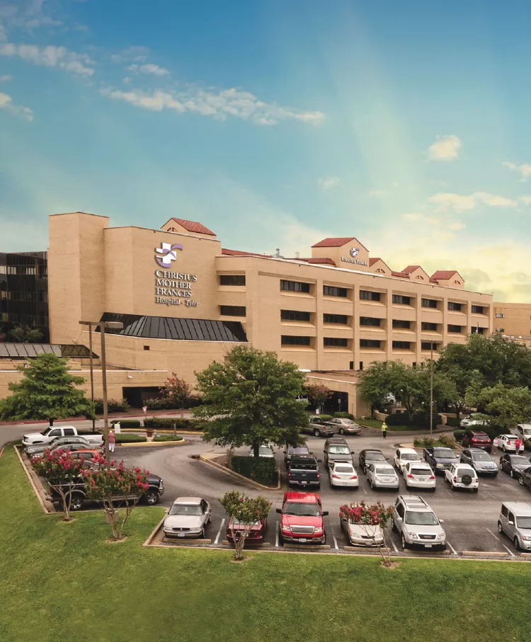 Exterior tan building and parking lot of CHRISTUS Mother Frances Hospital in Tyler, TX.