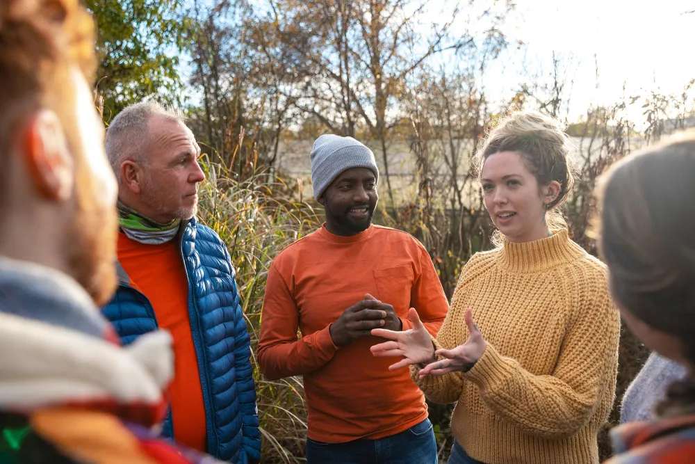 people talking together outside