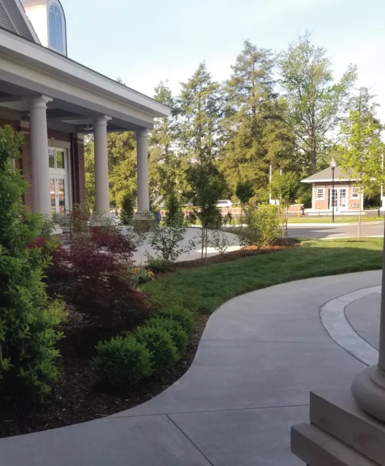 Front entrance of a Masonic Homes Kentucky, Louisville Campus showcasing a well-landscaped exterior.