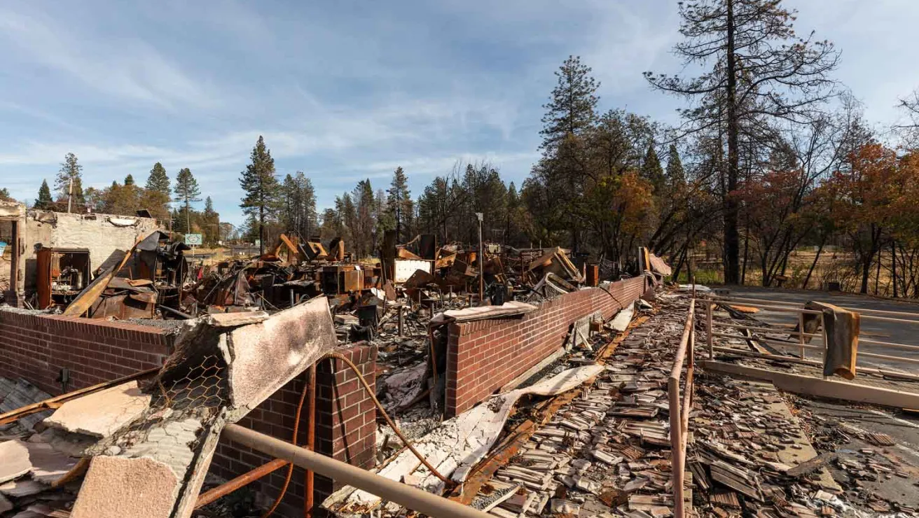 The remnants of a house devastated by a fire.