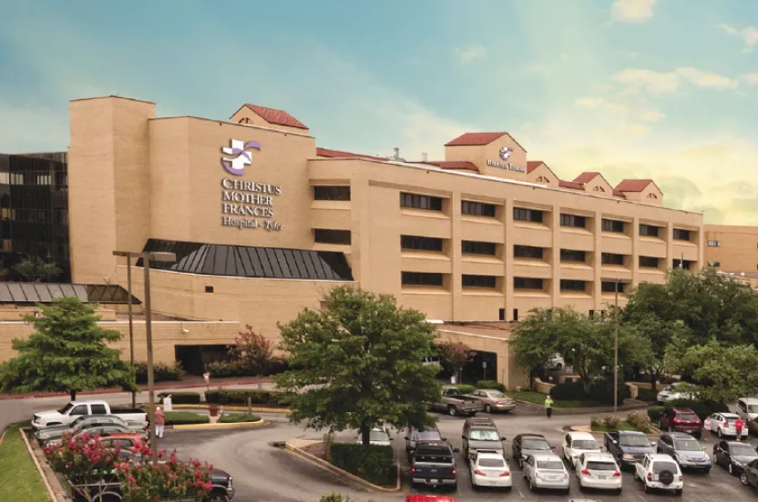 Exterior tan building and parking lot of CHRISTUS Mother Frances Hospital in Tyler, TX.