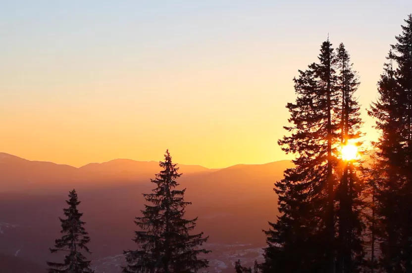 Media Name: hero-hazy-mountain-with-forest-silhouette-sunset.jpg